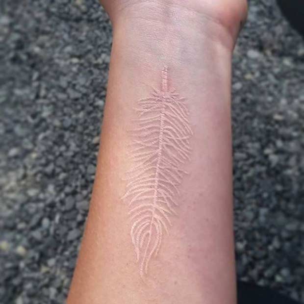 White Ink Feather Tattoo