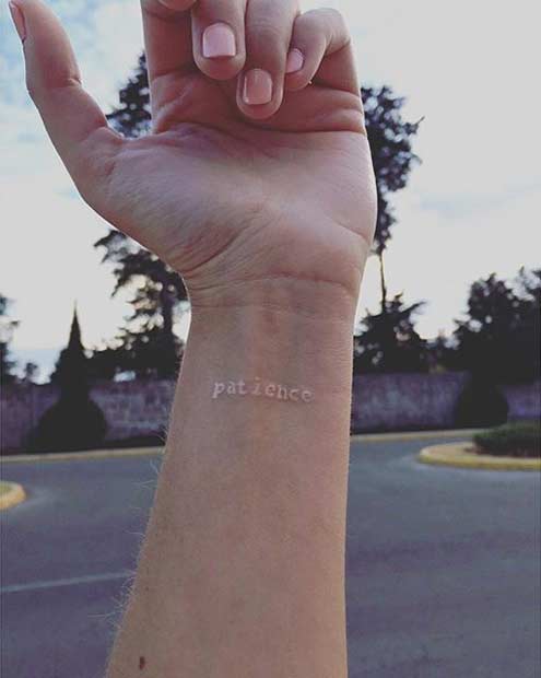 White Ink Patience Wrist Tattoo