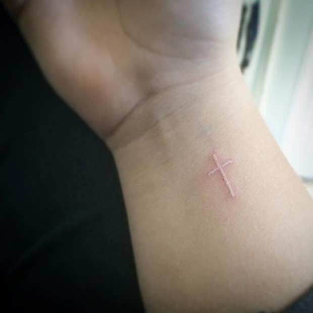 White Ink Cross Tattoo