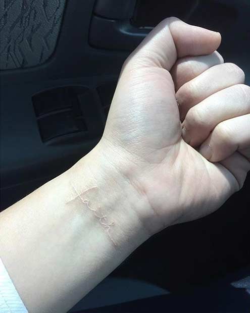 Faith White Ink Wrist Tattoo