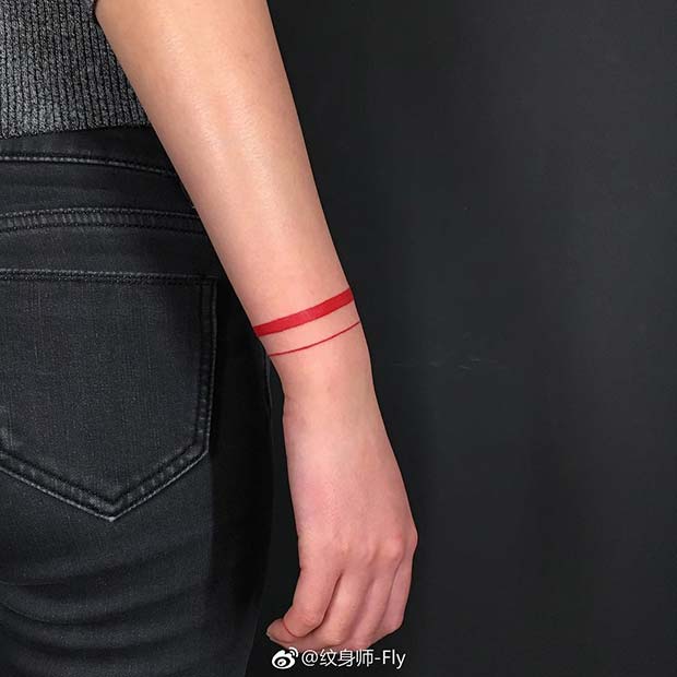 Red Ink Wrist Tattoo