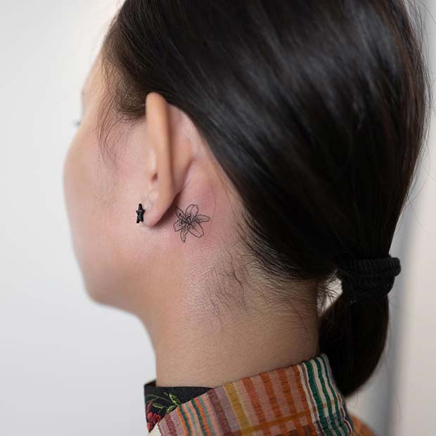 Small Lily Behind the Ear Tattoo Idea