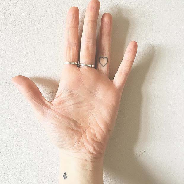 Subtle Heart Finger Tattoo