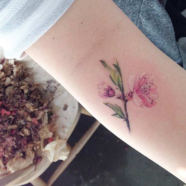 Small Watercolor Flower Arm Tattoo Idea