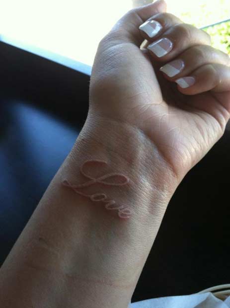 White Ink love Wrist Tattoo