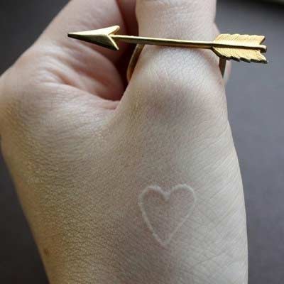 Small White Ink Heart Tattoo