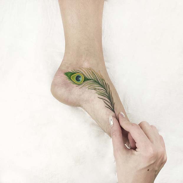 Vibrant Peacock Feather Foot Tattoo