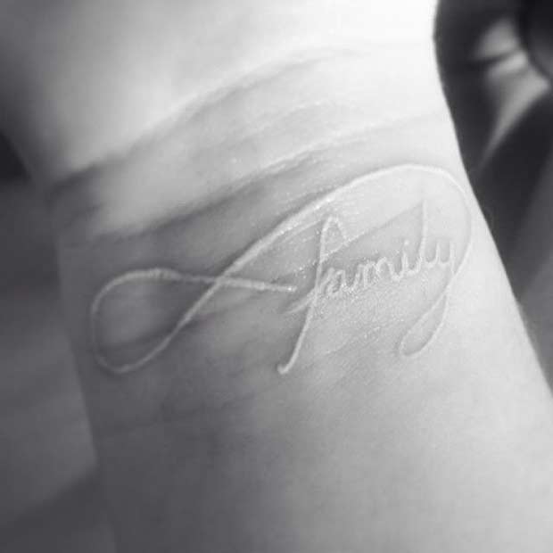 White Ink Family Infinity Wrist Tattoo