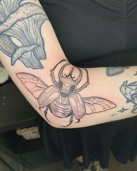 A Funky Little Atlas Beetle Tattoo