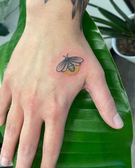 Adorable Little Firefly Tattoo on Hand