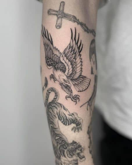 Aggressive Eagle Tattoo Holding Crab in Beak