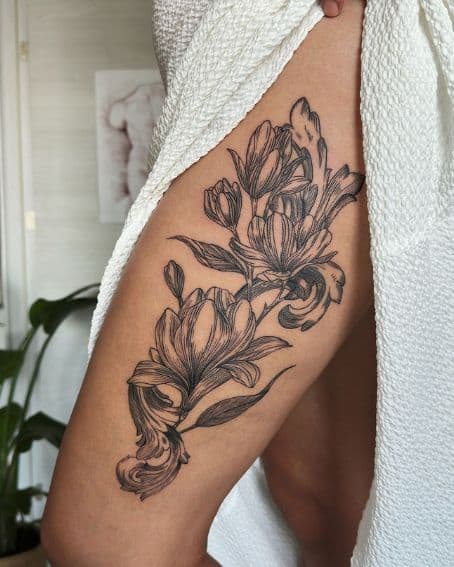 Black Floral Magnolia Tattoo on Thigh