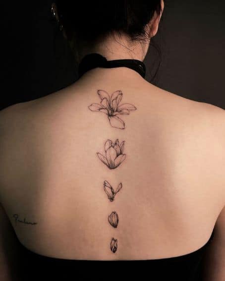 Blooming Magnolia Flower Tattoo on Spine
