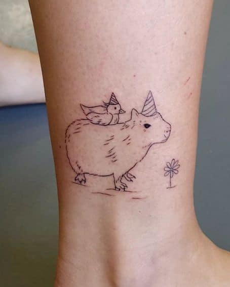Capybara Tattoo with a Duckling