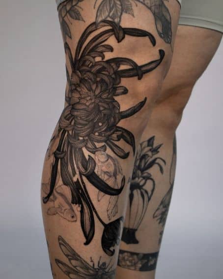 Chrysanthemum and Fishes Tattoo on Knee
