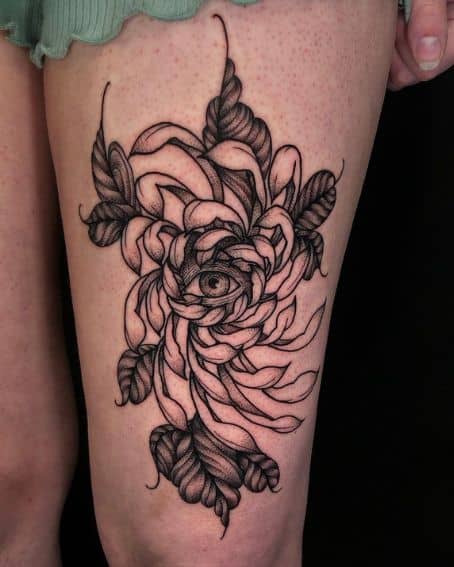 Chrysanthemums Have Eyes Tattoo on Thigh