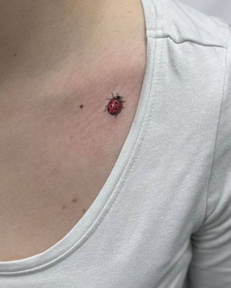 Colourful Ladybug Tattoo on Collarbone