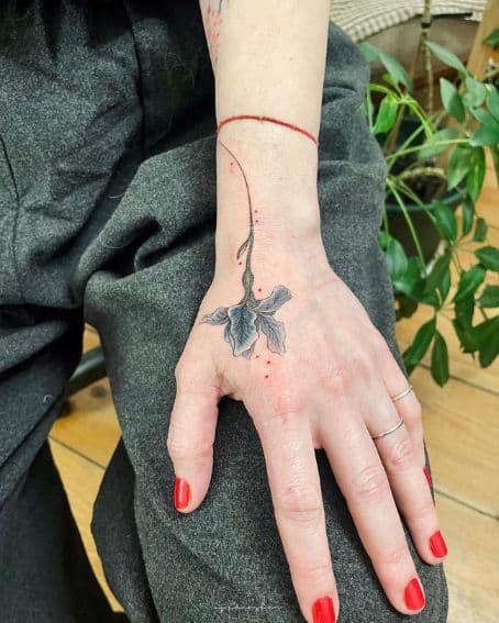 Cover-up Iris Tattoo on Hand