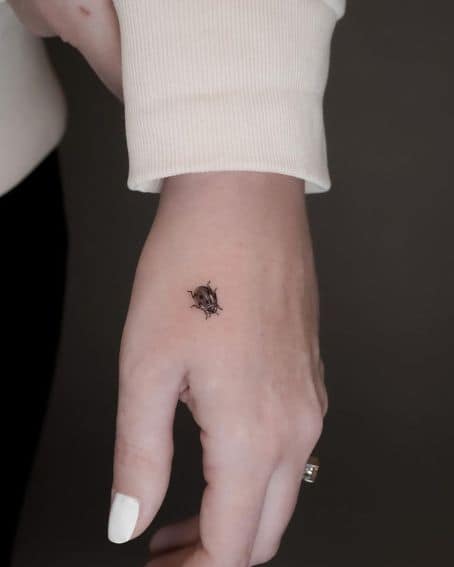 Cute Tiny Ladybug Tattoo on Hand