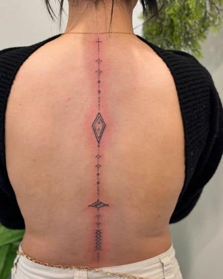 Delicate Polynesian tattoo art on the back