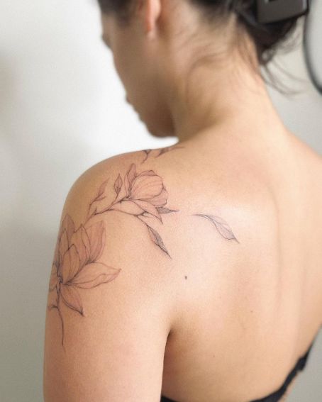 Fine Line Magnolia Shoulder Tattoo