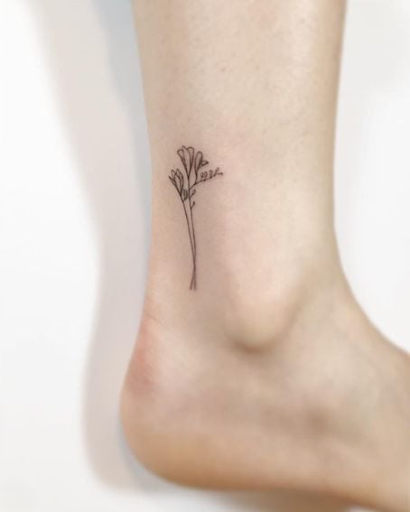 Fineline Freesia Flower Tattoo on Ankle