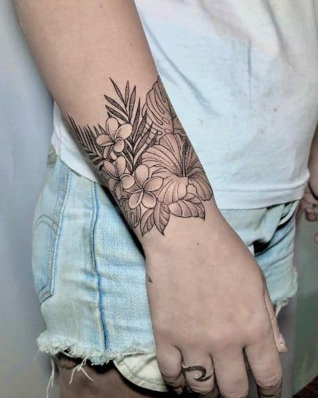Fineline Hibiscus Flower Tattoo on Wrist