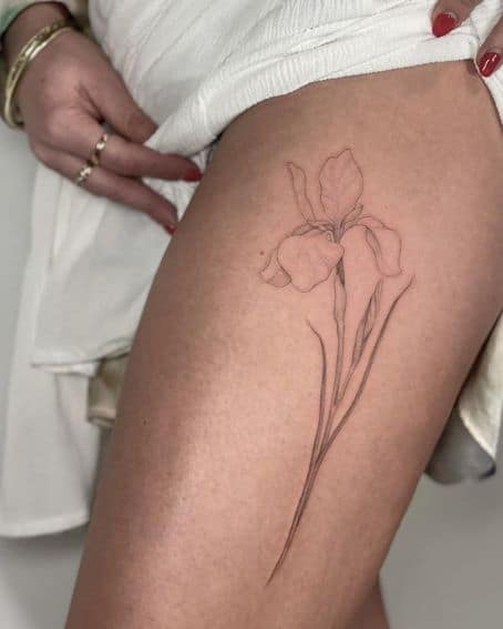 Fineline Iris Tattoo on Thigh