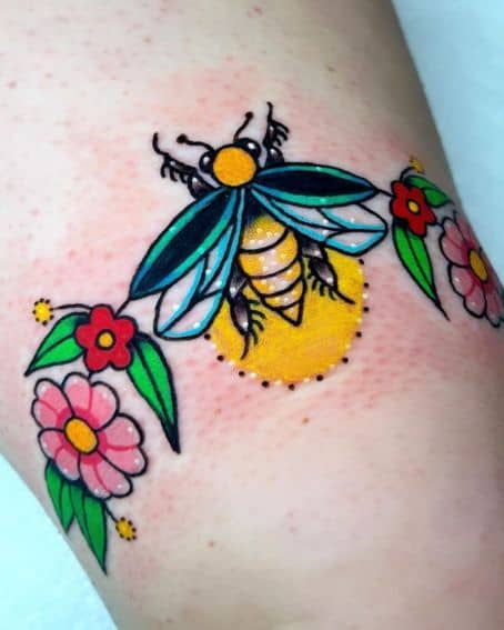 Floral Firefly Tattoo on Knee