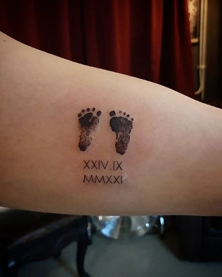 Footprint Tattoo with Roman Numbers