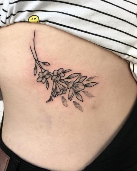 Freesia Flowers Tattoo on Ribs
