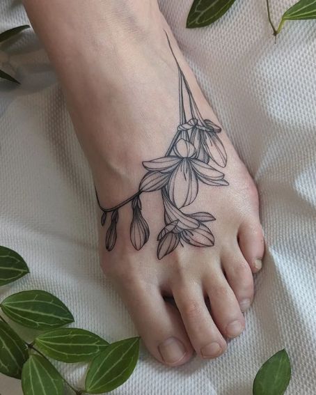 Freesia Tattoo Wrapping Around The Foot