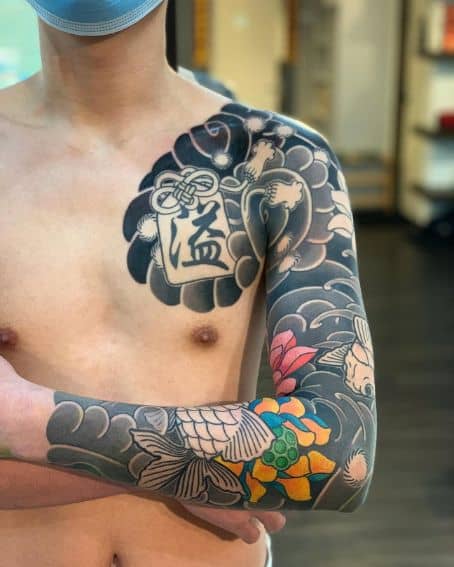 Full Sleeve Goldfish Tattoo