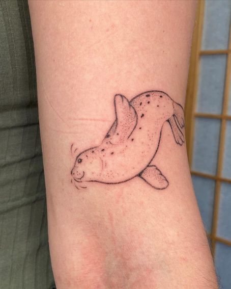 Hand Poked Seal Tattoos