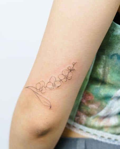 Linework Orchid Tattoo on Above The Arm