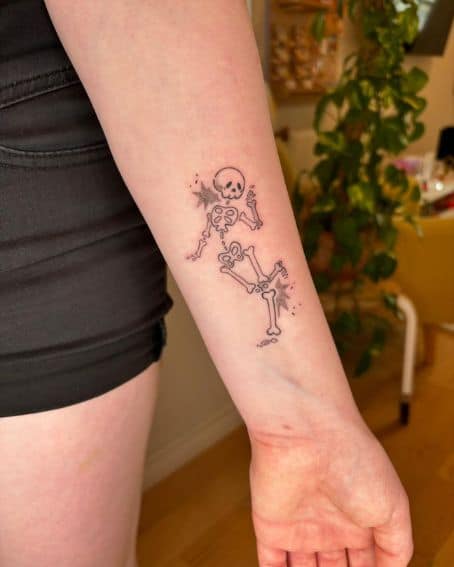 Little Dancing Skeleton Tattoo on Wrist