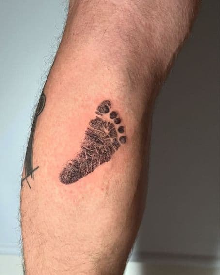Little Footprint Tattoo on Back Leg
