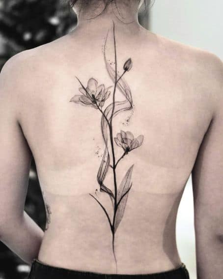 Magnolia Blooming Tattoo on The Spine
