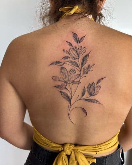 Magnolia Floral Tattoo on Spine