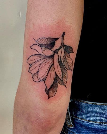 Magnolia Flower Tattoo Near the Elbow