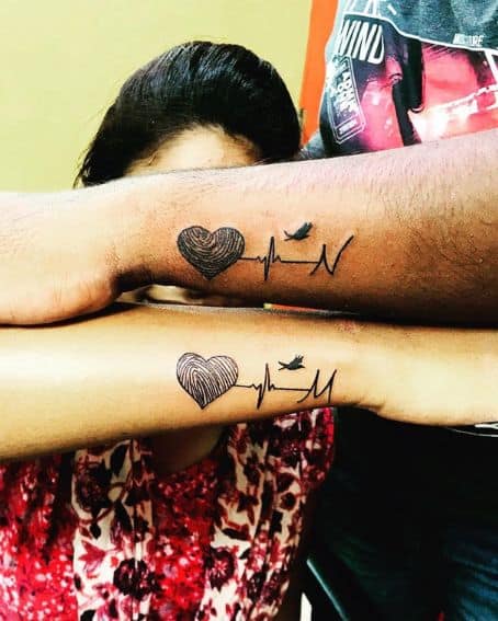 Matching Fingerprint Tattoo with Heartbeat Line