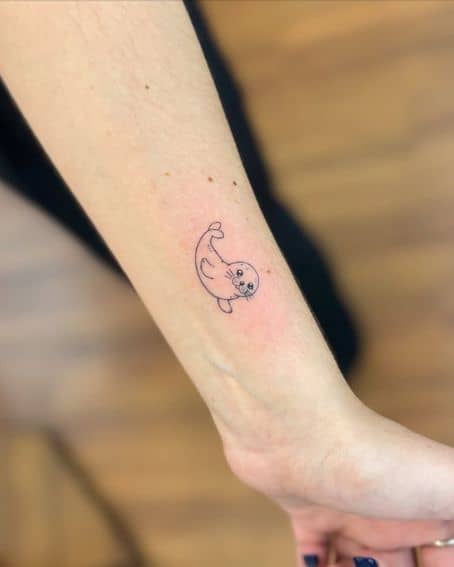 Minimalist Seal Tattoo