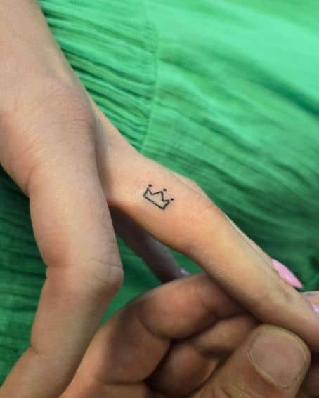 Minimalistic Crown Tattoo on Finger