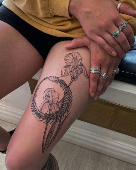Ouroboros and Iris Tattoo on Thigh