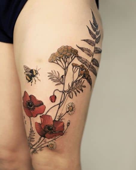 Poppy and Bumble Bee Tattoo on Thigh