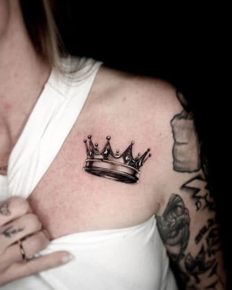 Shaded Crown Tattoo near the Collarbone