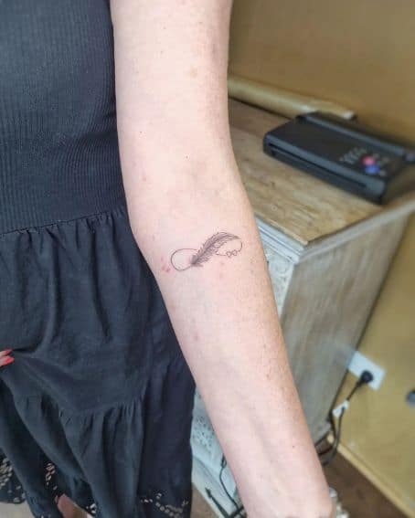 Small Feather Infinity Tattoo on Arm