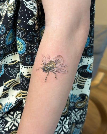 Small Firefly Tattoo on Arm