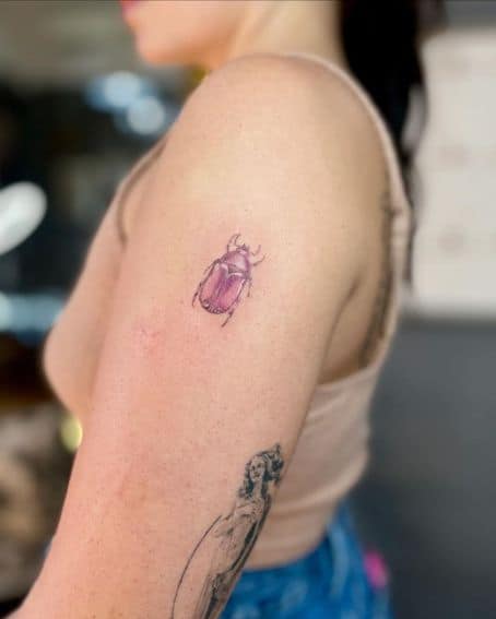 Small Pink Beetle Tattoo on Arm