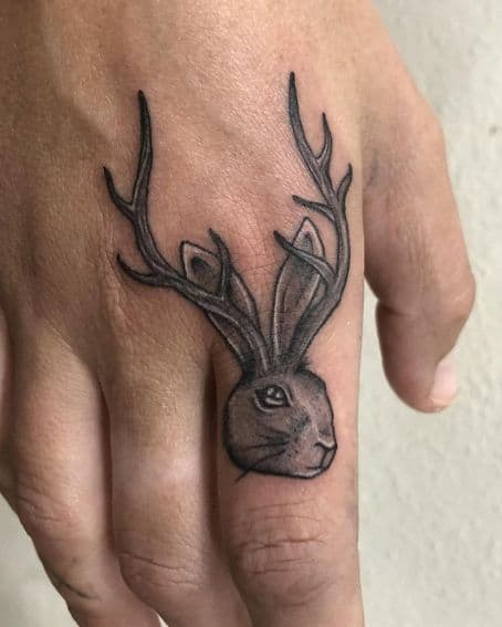 Super Fun Lil Jackalope Tattoo on Finger